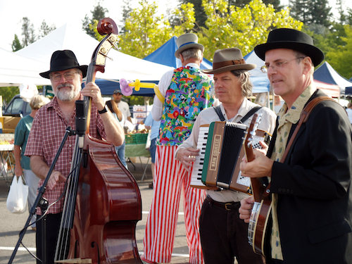The Loose Acoustic Trio played a Farmers Market most Saturday mornings. The clown in the back is actually 7 feet tall. No kidding.